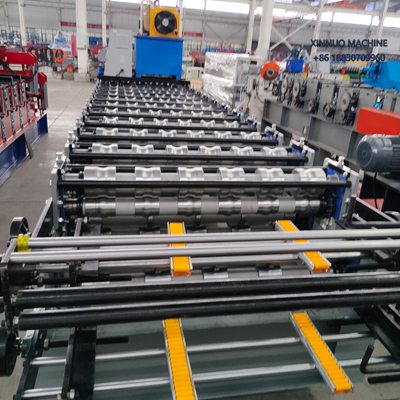 Compact double layer roll forming machine producing two trapezoidal roof sheet profiles efficiently.