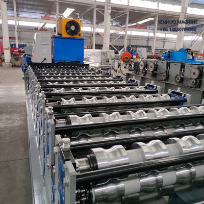 Compact double layer roll forming machine producing two trapezoidal roof sheet profiles efficiently.