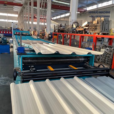 High-speed iron roof sheet roll forming machine with servo motor and chain drive for precise production.