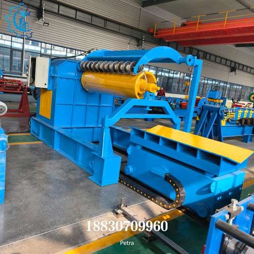 Detailed view of slitting blades on steel slitting line recoiler, showing precision cutting assembly for metal strip production