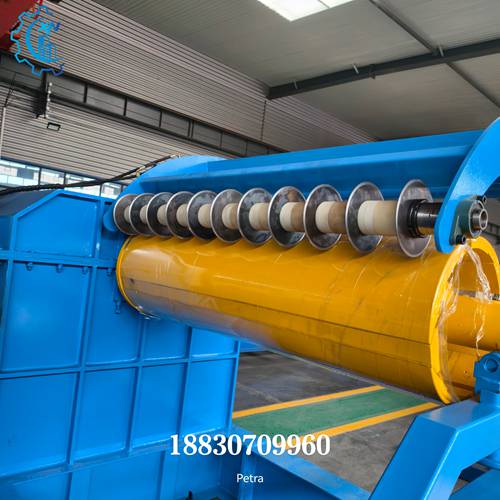 Detailed view of slitting blades on steel slitting line recoiler, showing precision cutting assembly for metal strip production