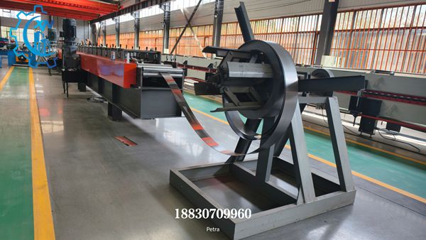 Heavy duty uncoiler feeding steel strip into Solar bracket roll forming machine