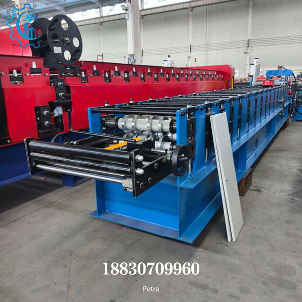 Side perspective of ridge cap roll forming machine showing heavy-duty base frame